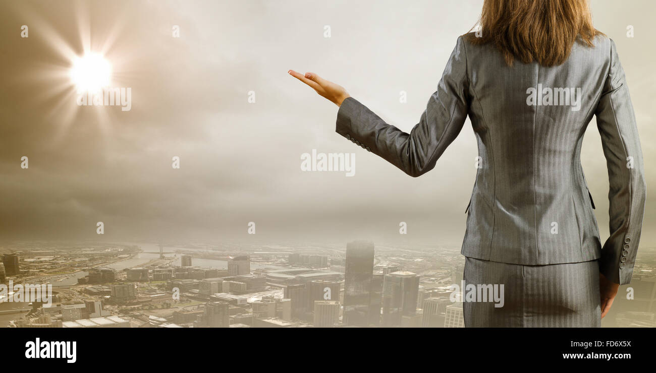 Back view of businesswoman against big city scene Stock Photo - Alamy