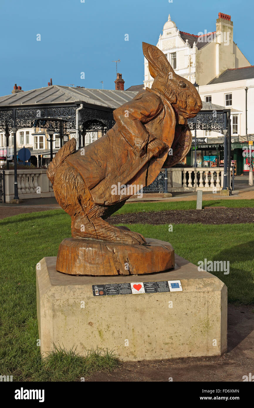 Carving of Alice In Wonderland Wonderlands white rabbit in Llandudno Stock Photo