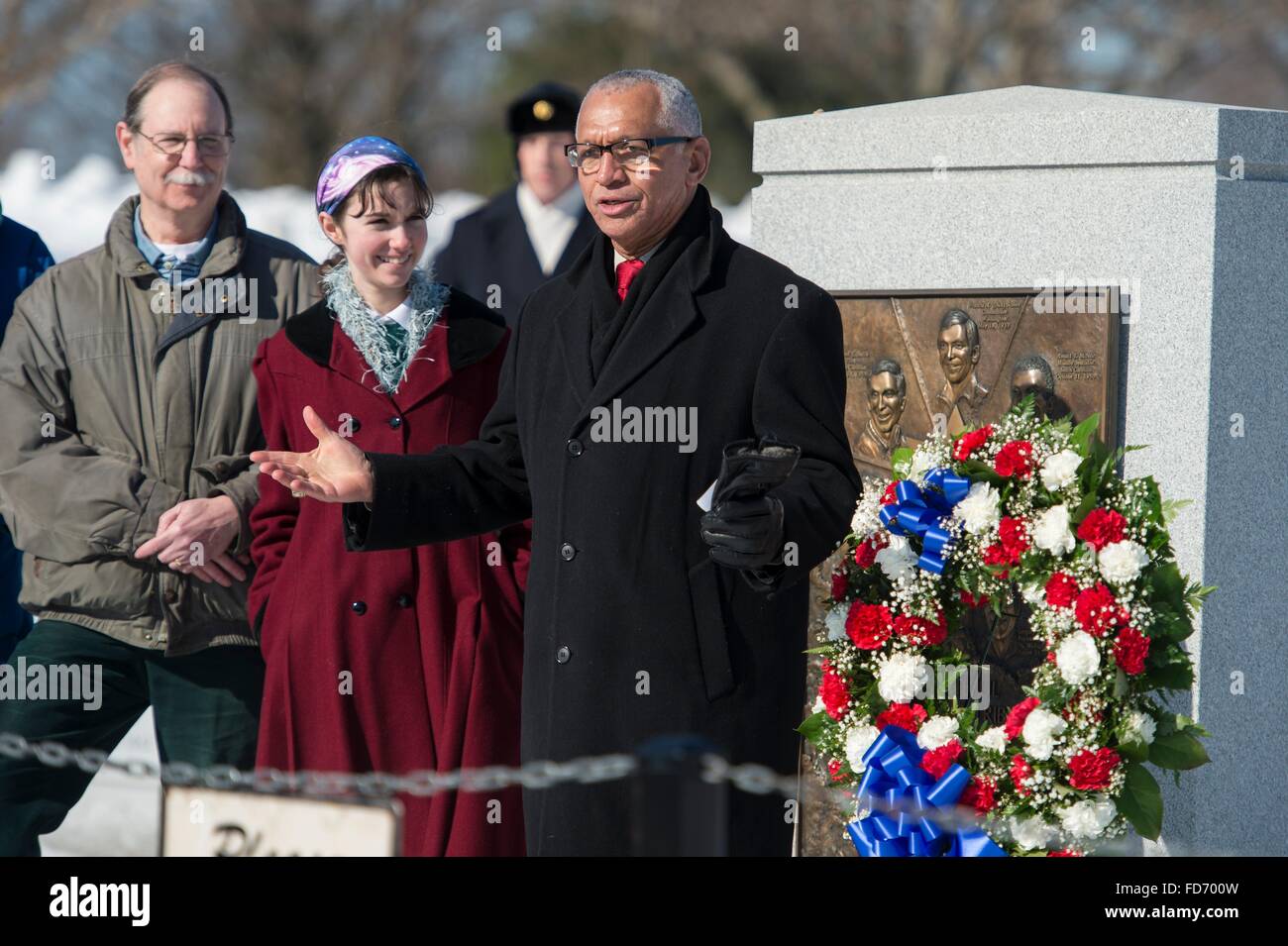 Arlington, Virginia, USA. 28th January, 2016. NASA Administrator Charles Bolden alongside Chuck Resnik, left, brother of Challenger astronaut Judith Resnik and his daughter, Jenna Resnik, during a wreath laying ceremony as part of NASA's Day of Remembrance on the 30th anniversary of the Challenger explosion at Arlington National Cemetery January 28, 2016 in Arlington, Virginia. The wreaths were placed in memory of those men and women who lost their lives in the quest for space exploration. Credit:  Planetpix/Alamy Live News Stock Photo