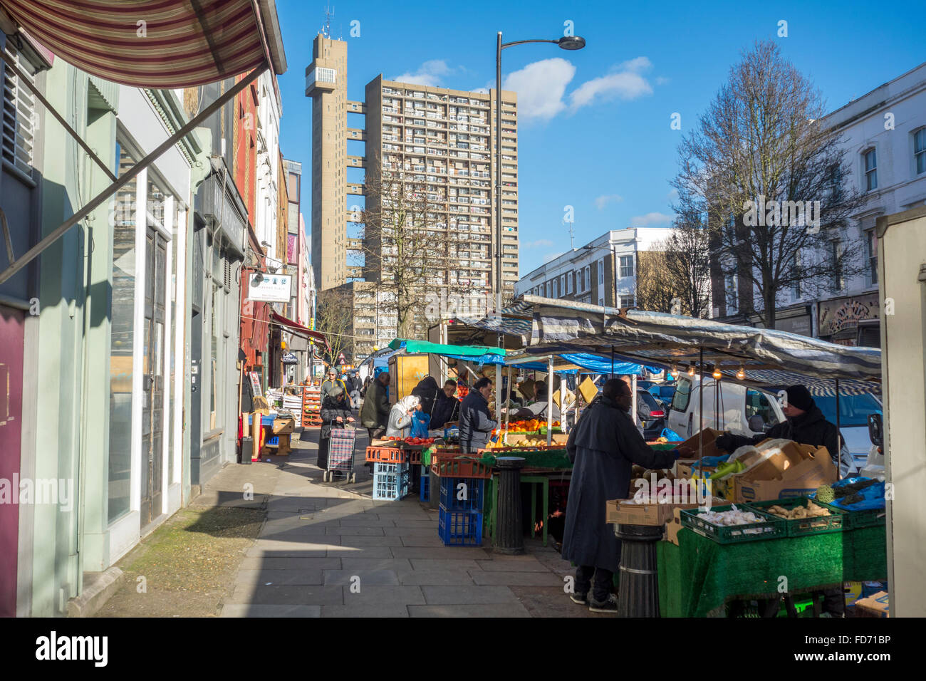 Market stalls on Golborne Road with Trellick Tower in the background, North Kensington, London, UK Stock Photo