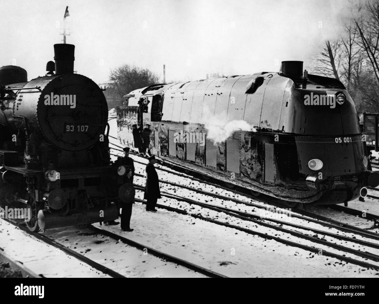 A streamlined steam locomotive and a conventional engine, 1936 Stock Photo