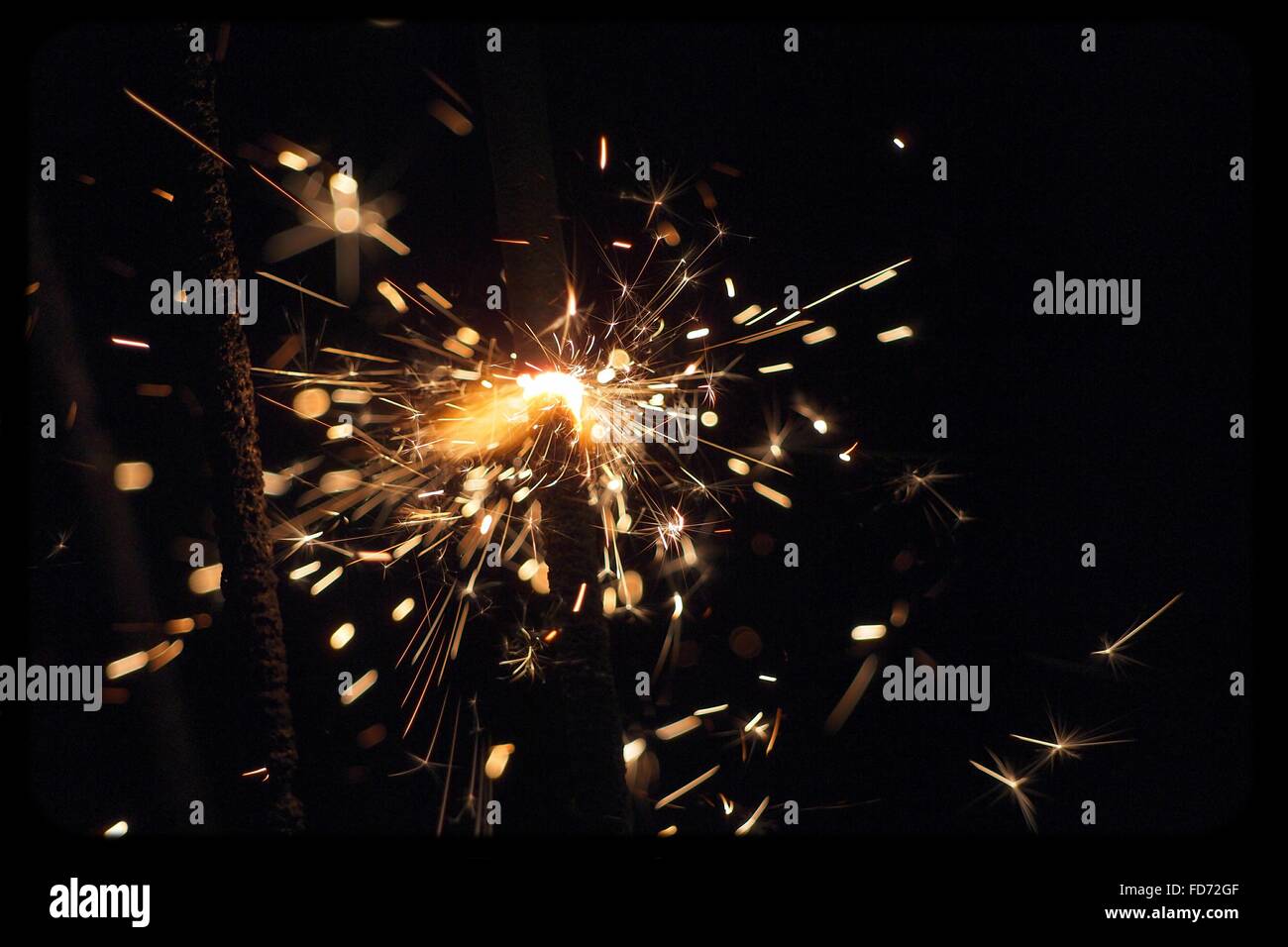 Close-Up Of Sparks At Night Stock Photo