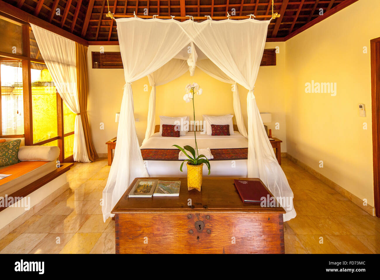 Hotel rooms with four-poster bed and flowers heart, heart made of flowers, decorated double bed, tourism, travel, Ubud, Bali, Stock Photo