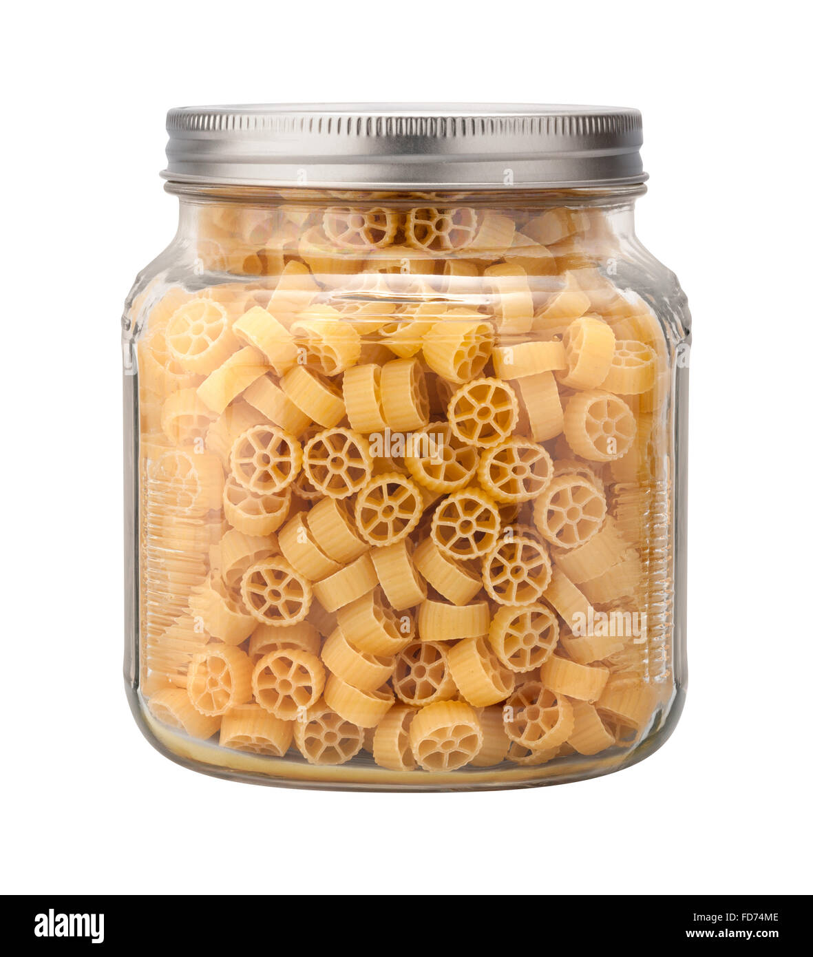 Mini Wheel Pasta in a Glass Jar. The image is a cut out, isolated on a white background. Stock Photo