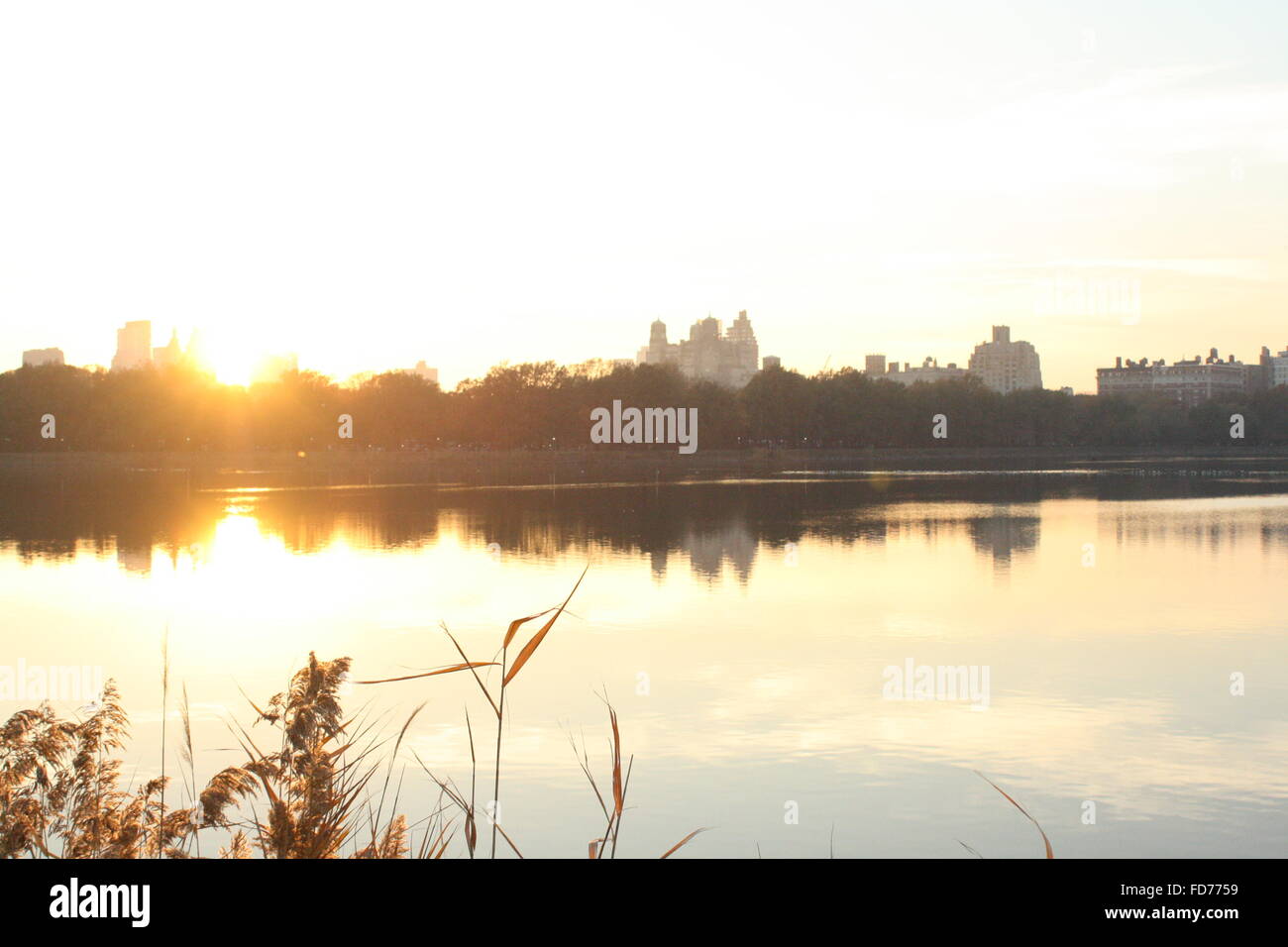 Upper west side skyline as seen from the upper east side across the Jaqueline Kennedy Onassis reservoir in Central park, New York City Stock Photo
