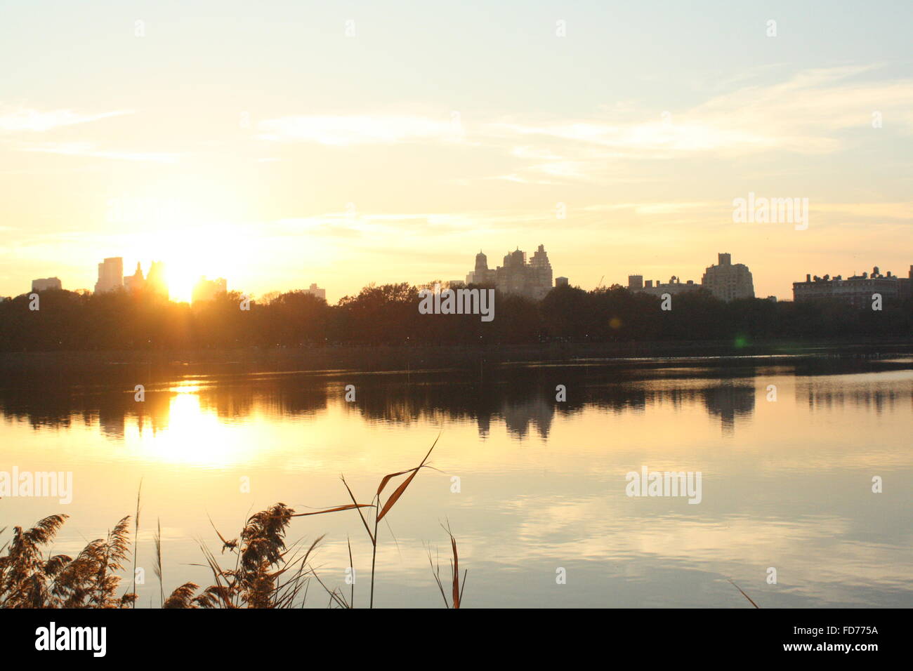 Upper west side skyline as seen from the upper east side across the Jaqueline Kennedy Onassis reservoir in Central park, New York City Stock Photo