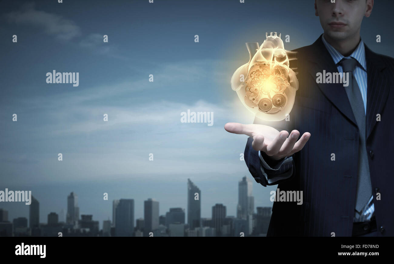 Close up of businessman holding digital heart in palm Stock Photo - Alamy