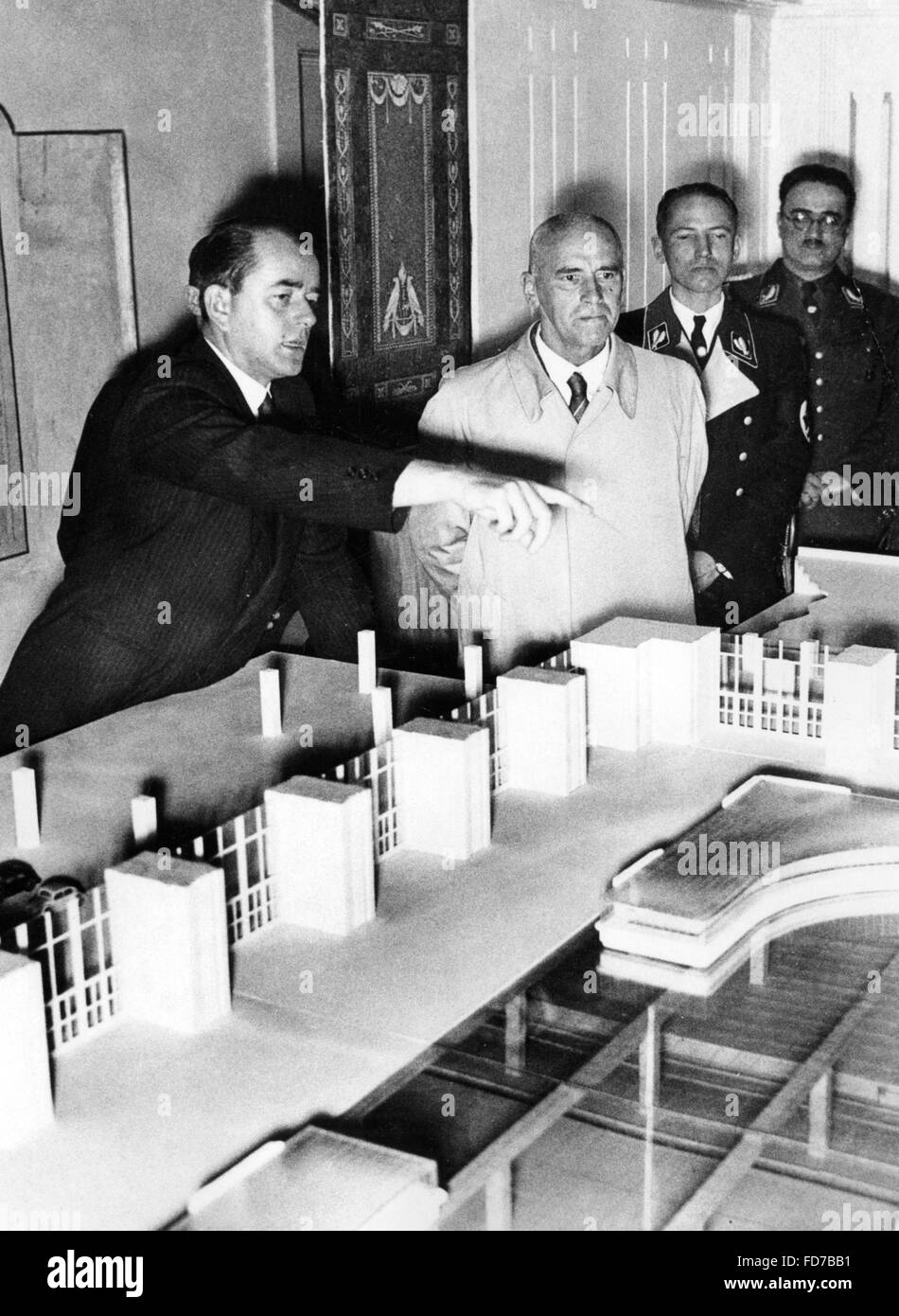 Albert Speer shows an architectural model to Wilhelm Frick, 1938 Stock Photo