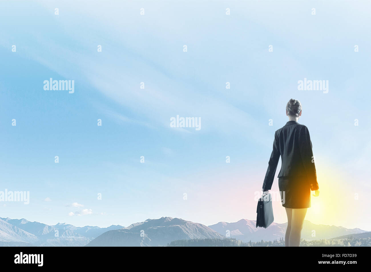 Rear view of businesswoman looking at sunset Stock Photo - Alamy