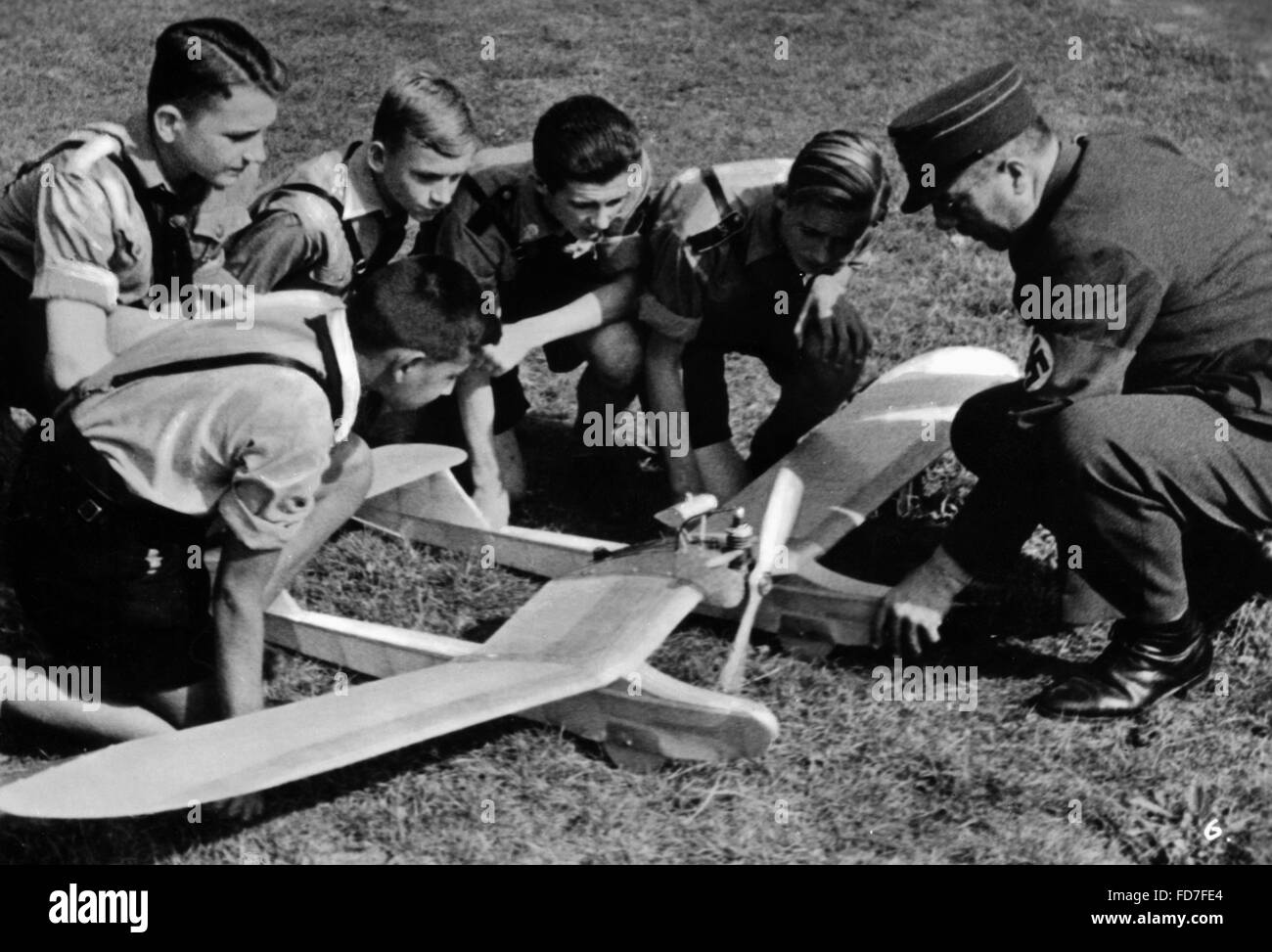 HJ members with model airplane, 1941 Stock Photo