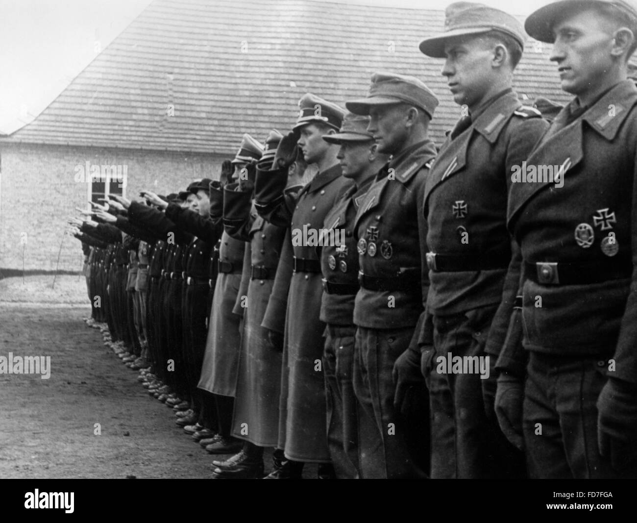 HJ members and armored infantry riflemen at roll call, 1944 Stock Photo