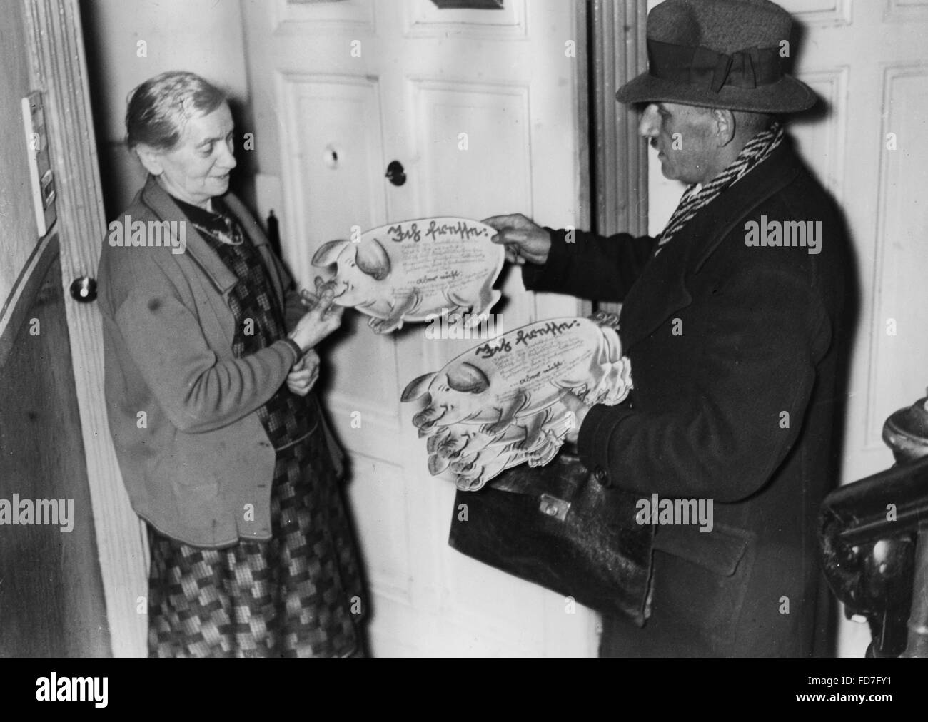 Distributing 'NSV pigs', 1937 Stock Photo