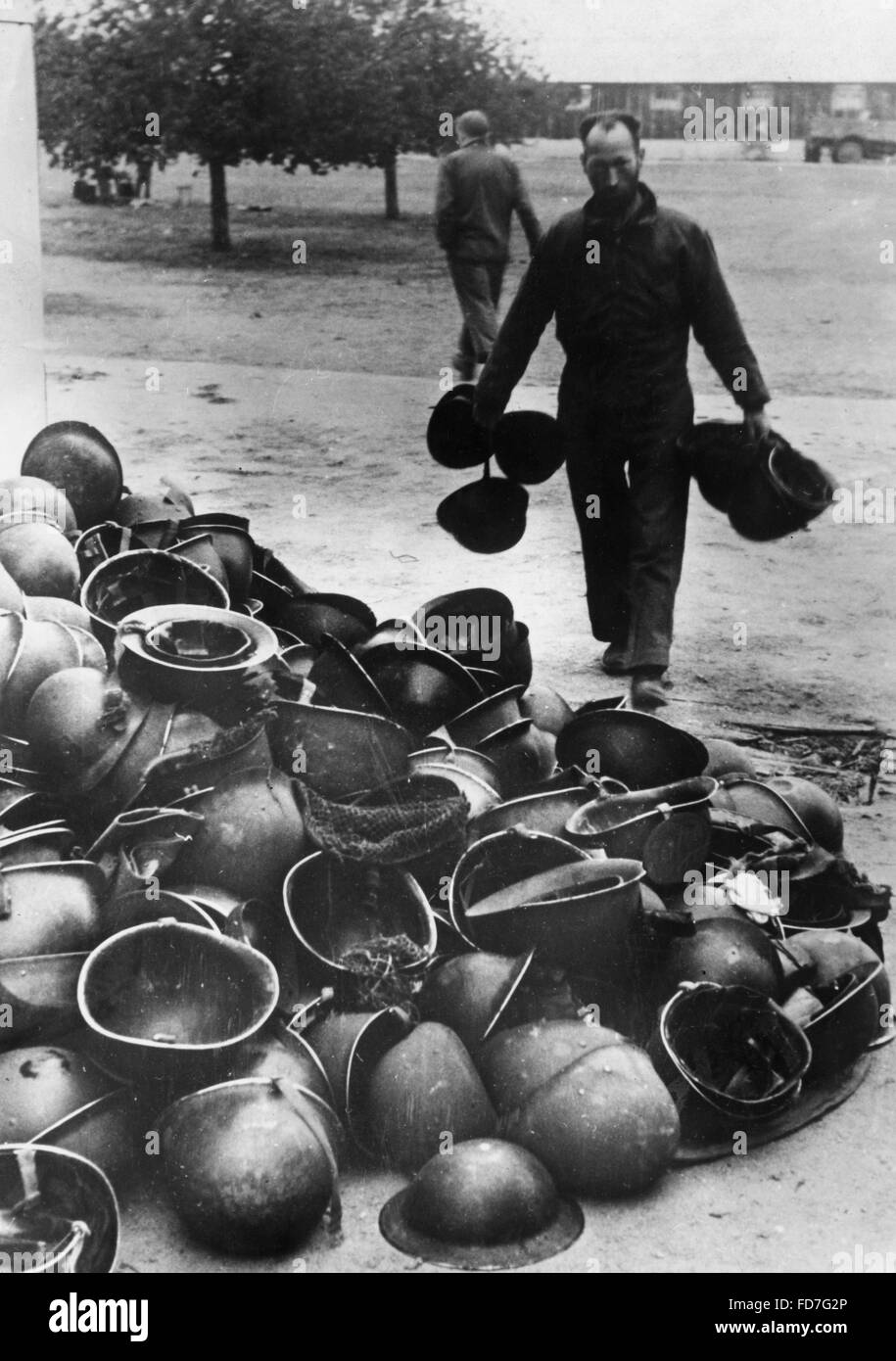 Helmets of Allied soldiers in a POW transit camp, 1944 Stock Photo