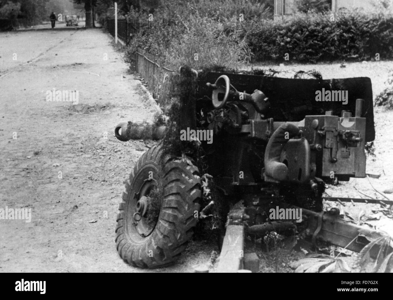 Destroyed British antitank gun on a street in Holland, 1944 Stock Photo ...