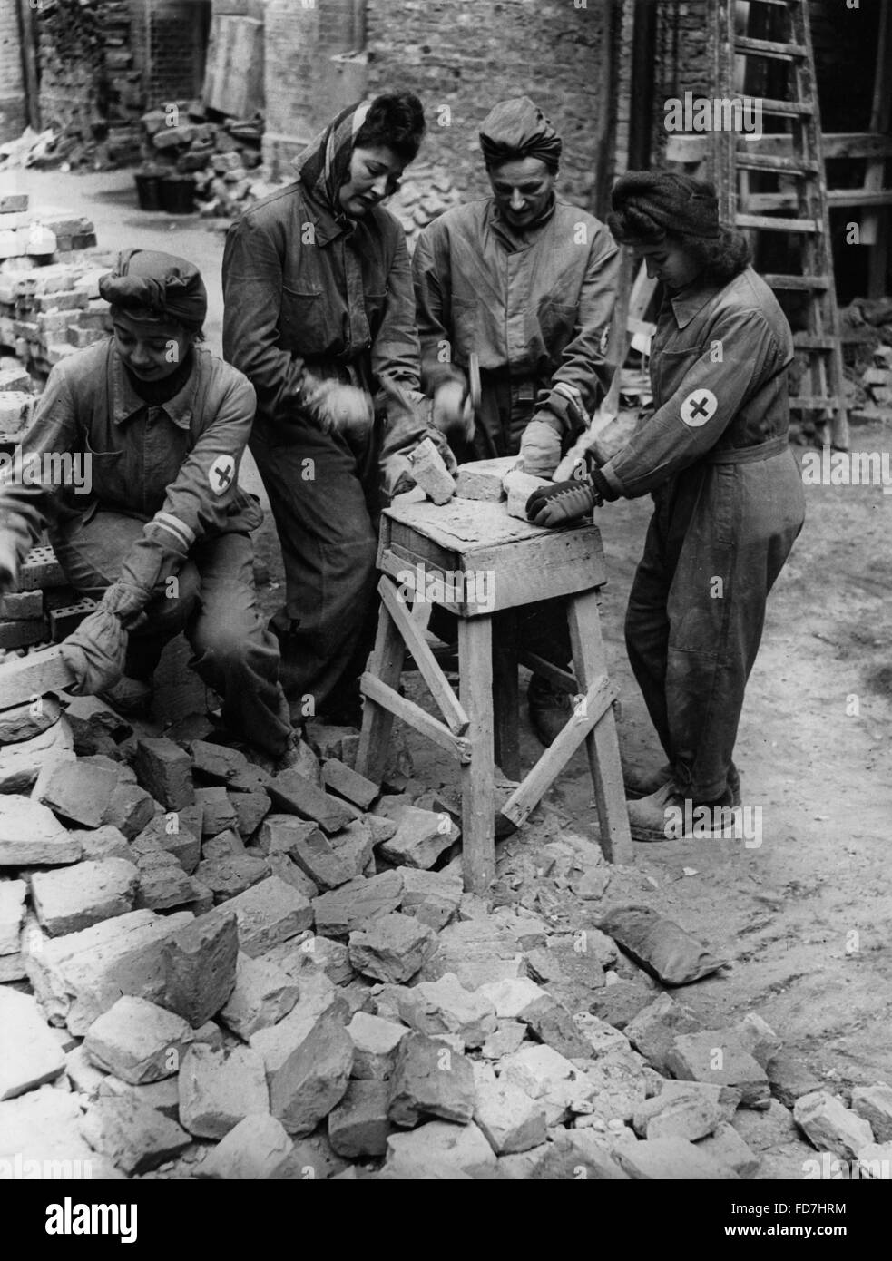 Cleaning up after an air raid, 1944 Stock Photo Alamy