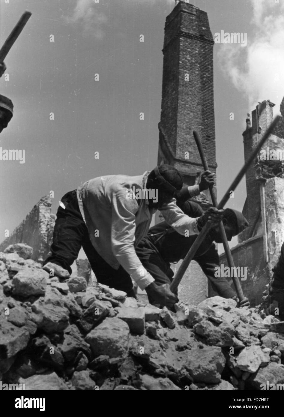 Looking for trapped people after an air raid Stock Photo