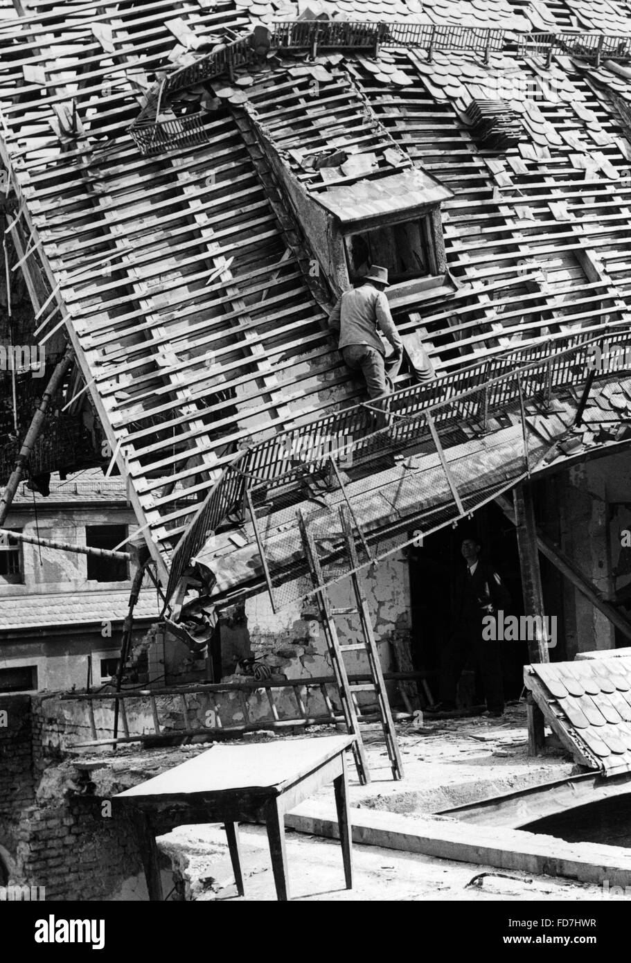 Cleaning up after an air raid Stock Photo Alamy