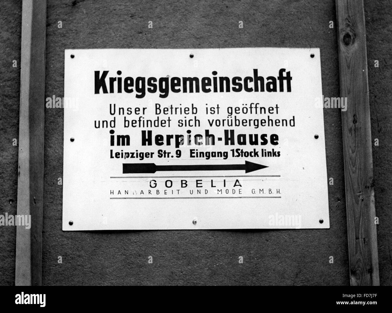 Sign of a relocated business, 1943 Stock Photo