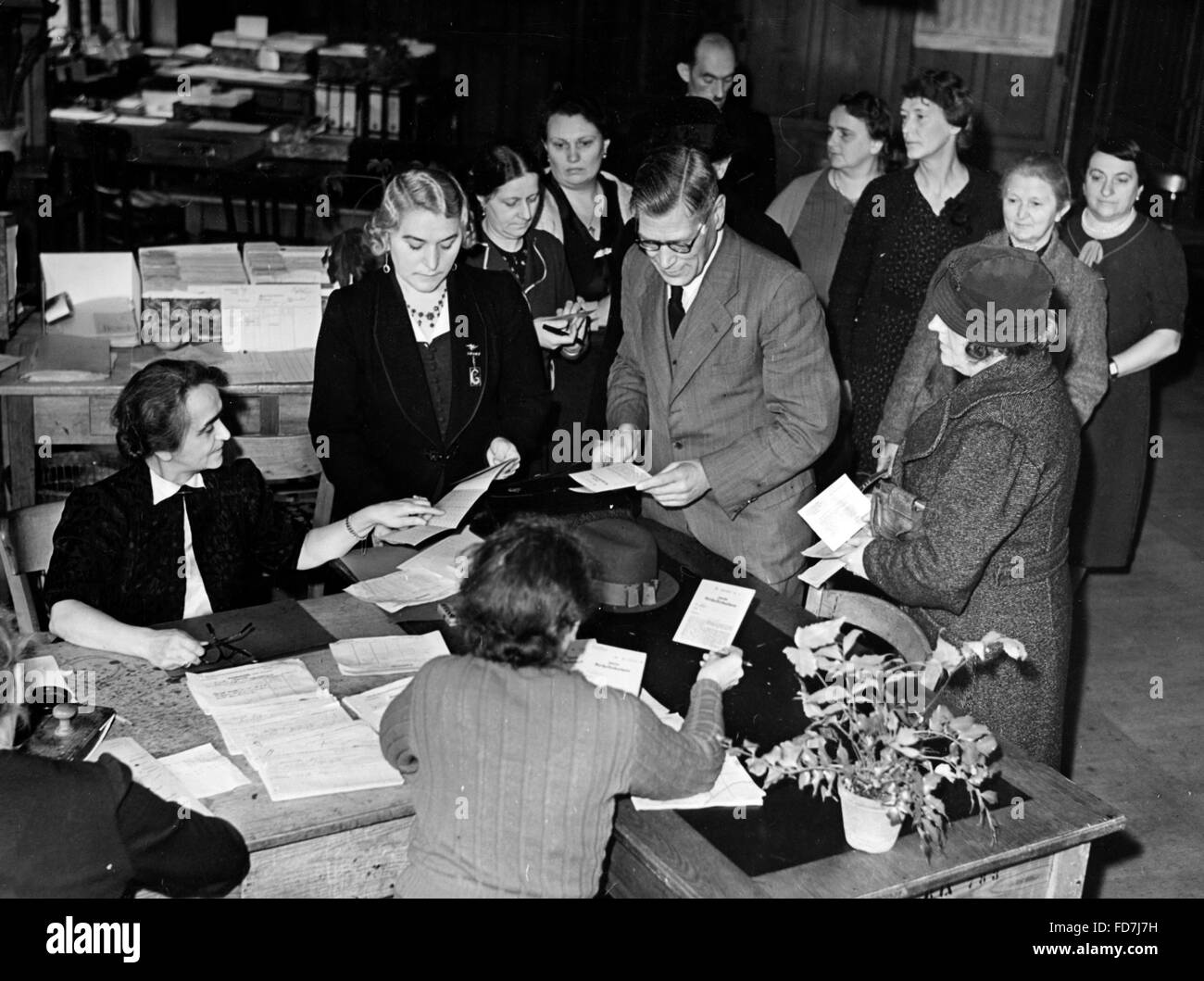 Issuing cloth coupons in Berlin, 1940 Stock Photo