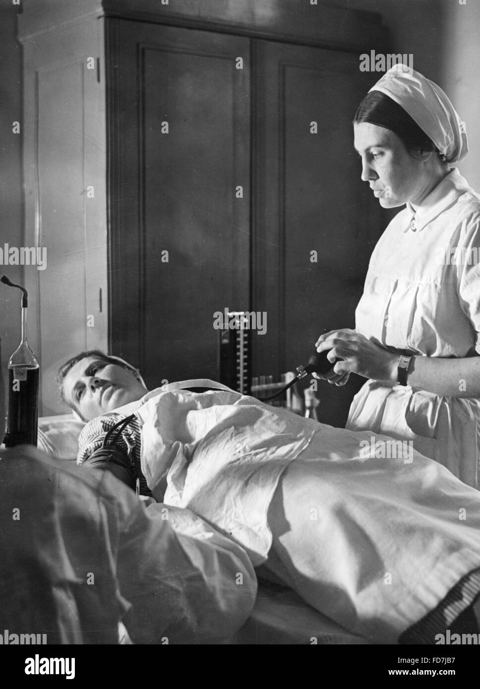 Red Cross nurse donating blood, 1940 Stock Photo - Alamy