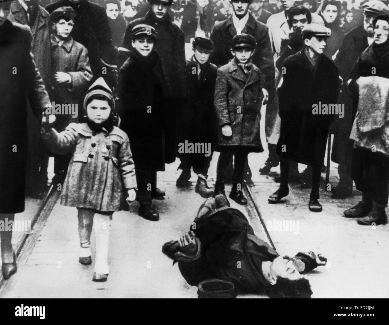 A collapsed person in the Warsaw Ghetto Stock Photo