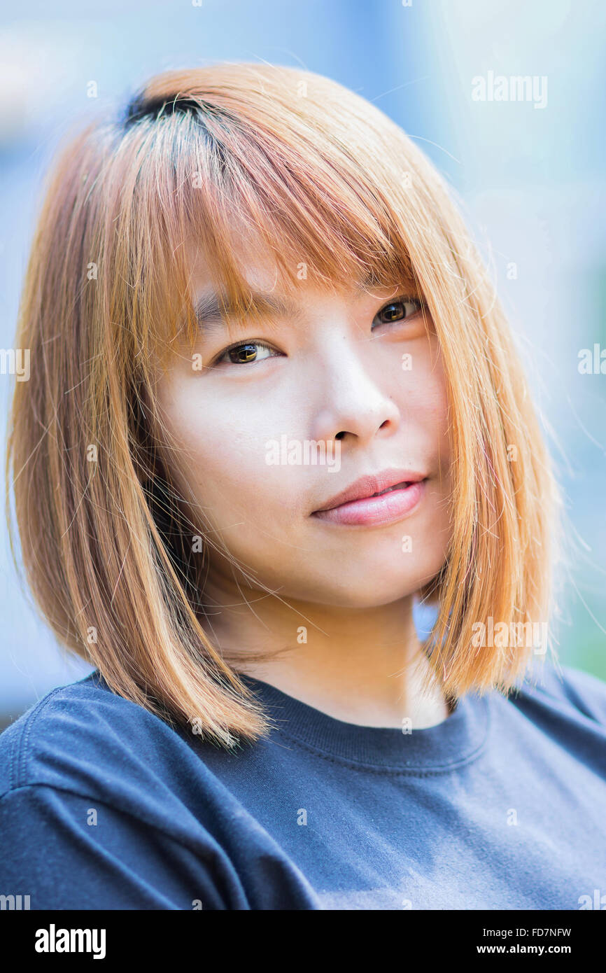 Young japanese woman smiling hi-res stock photography and images - Alamy