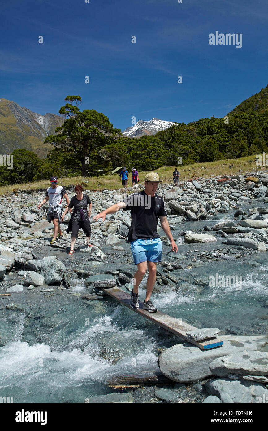 Crossing MacPherson Creek, Upper Matukituki Valley, near Wanaka, Otago, South Island, New Zealand Stock Photo