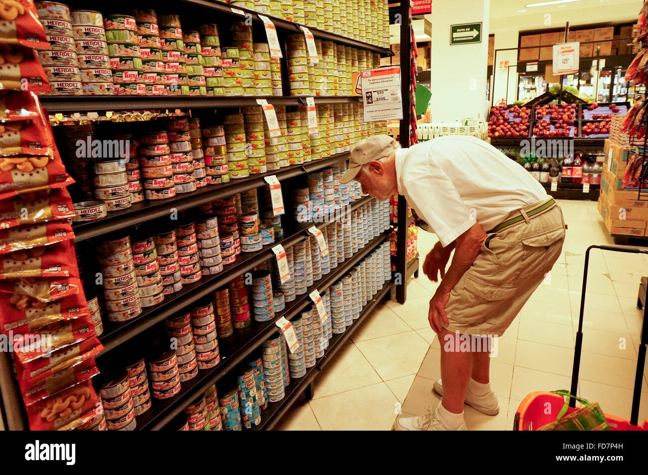 Elderly man shopping at grocery store Stock Photo