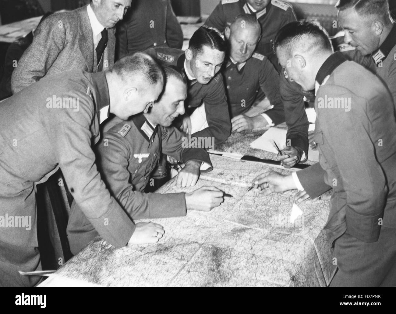 Officers studying maps in the military academy, 1935 Stock Photo