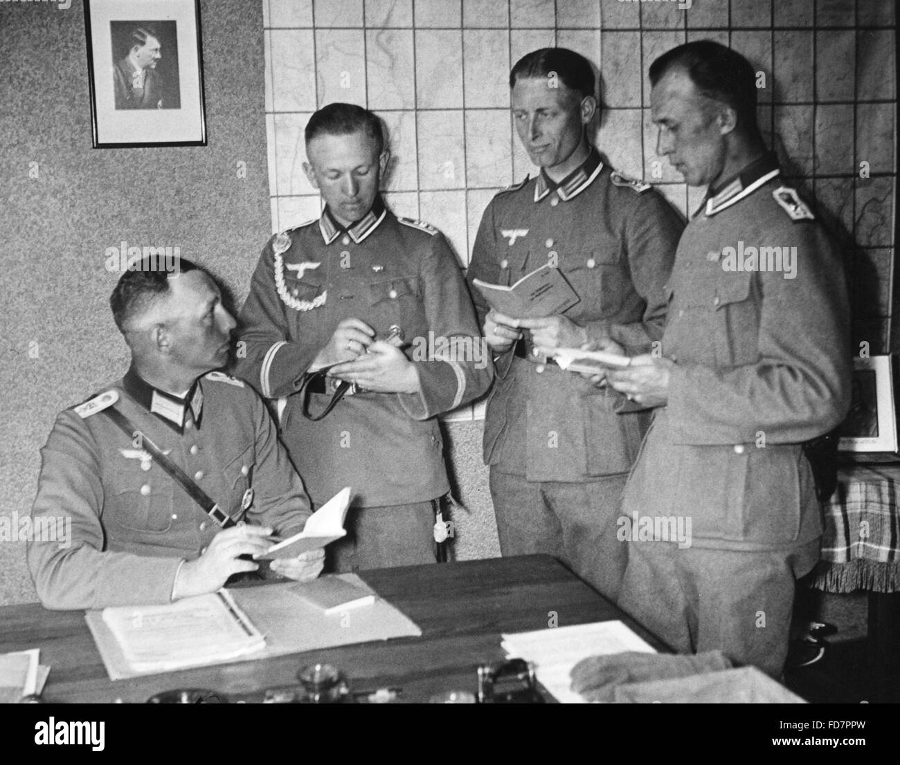 Officers of the 67th Infantry Regiment Spandau allotting duty roster, 1938 Stock Photo