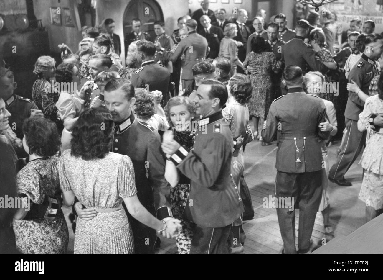 Wehrmacht soldiers dancing with women at a maneuver ball, 1939 Stock