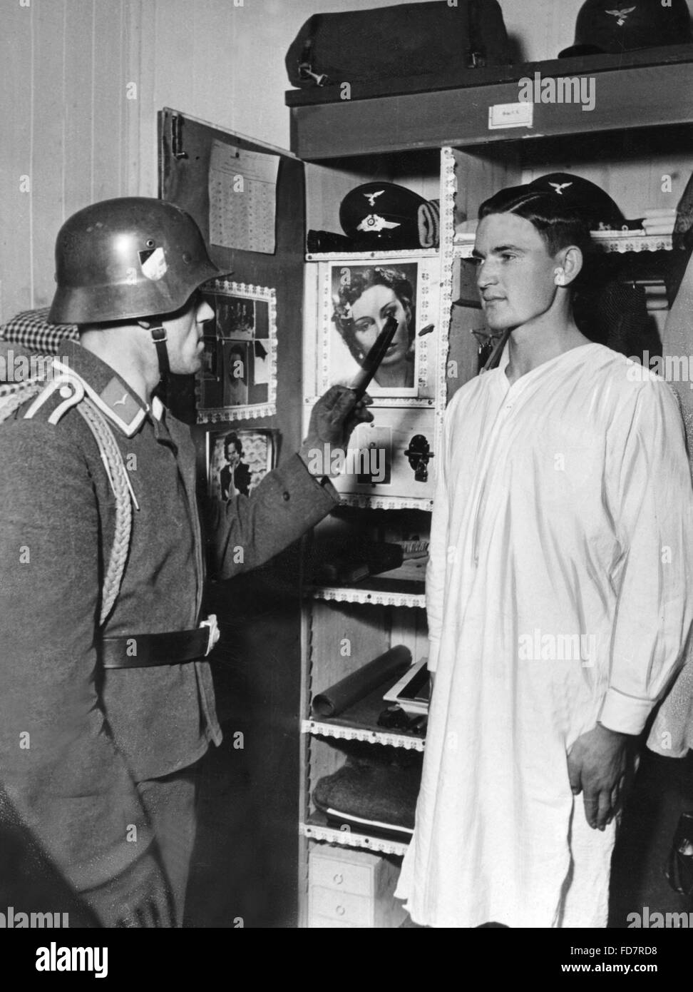 Noncommissioned officer of the Luftwaffe at the evening locker control in the 30s Stock Photo