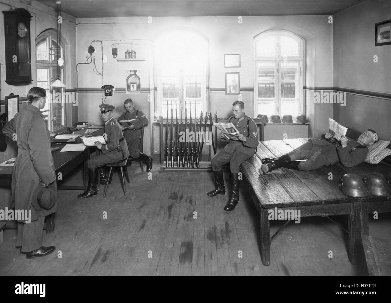 Reichswehr soldiers in the guard room at the barracks entrance Stock Photo