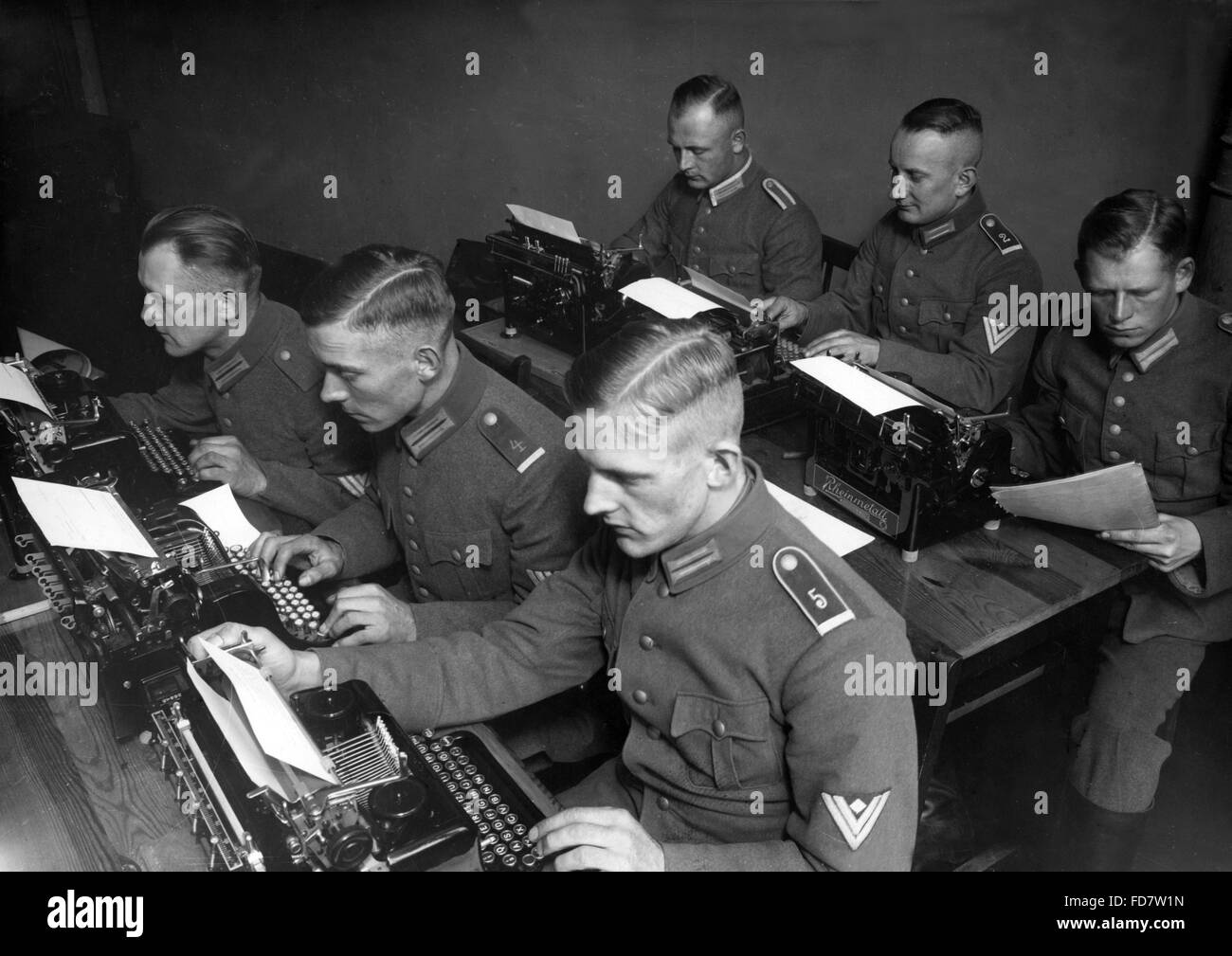 Soldiers of the Reichswehr at typewriters, 1934 Stock Photo