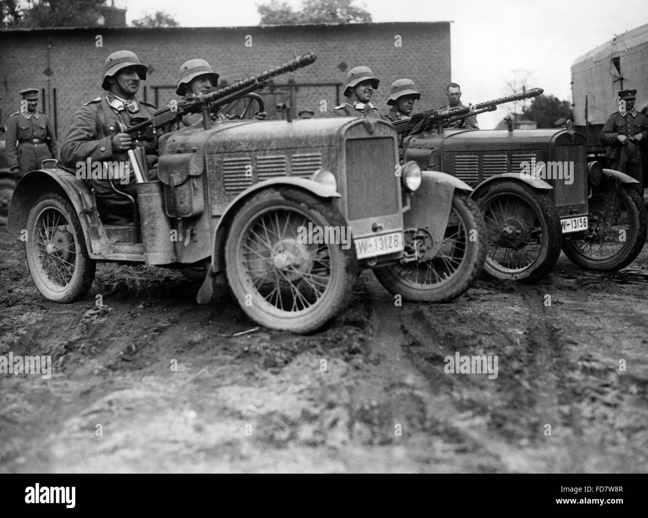 Soldiers in small cars with light machine guns Stock Photo