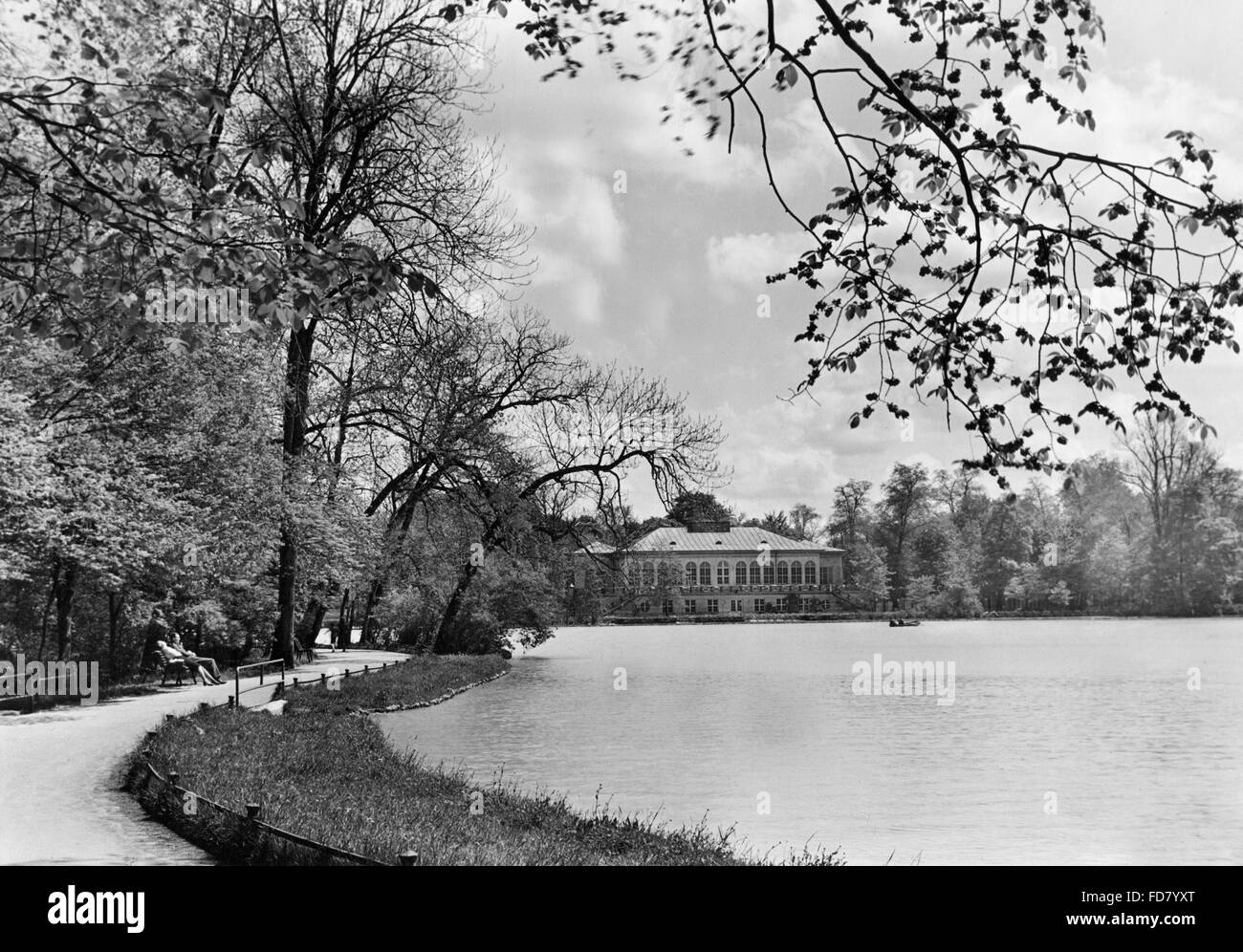 The Kleinhesseloher Lake with the lake house in the English Garden in Munich Stock Photo