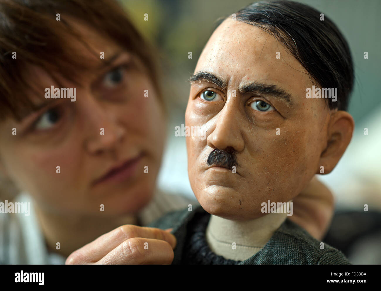 Louise Nowitzki prepares hand puppets for the performance '1913 - Der Sommer des Jahrhunderts' (lit. 1913 - the summer of the century) in a workshop of the puppet theatre in Halle/Saale, Germany, 19 January 2016. They include puppets of dictator Adolf Hitler. The puppet play premieres on 12 March 2016. PHOTO: HENDRIK SCHMIDT/DPA Stock Photo