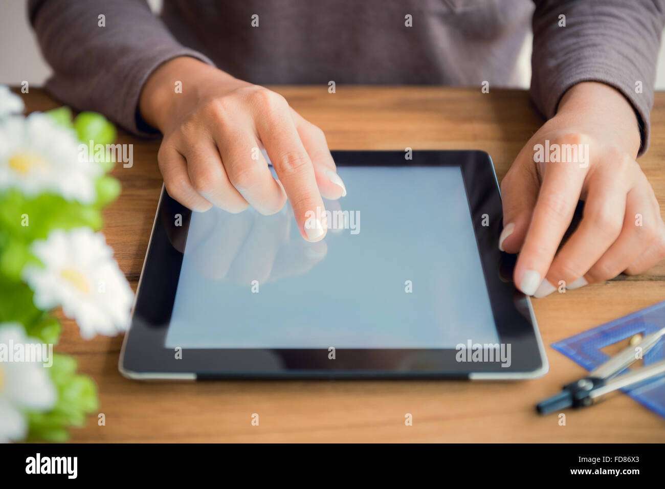 hand touch on tablet screen Stock Photo