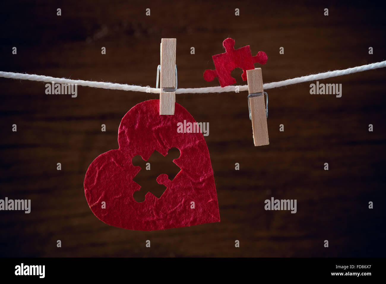 heart love jigsaw on cloth rope Stock Photo