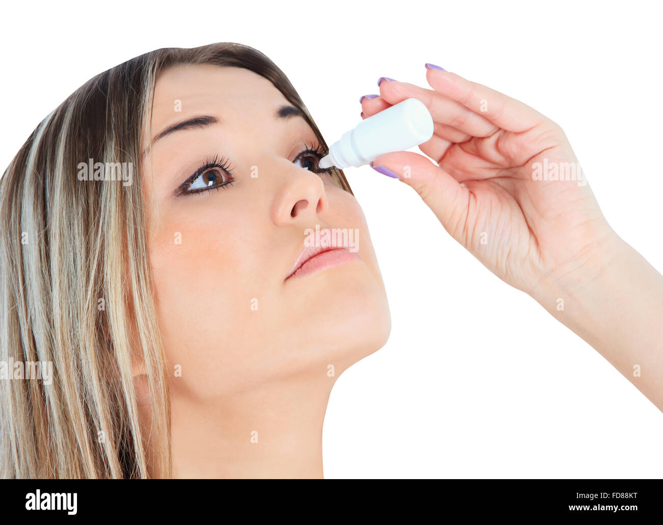 woman dripping eye with eyes drops Stock Photo