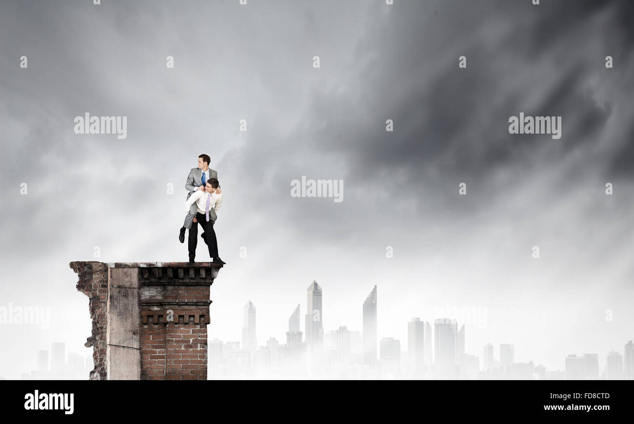 Businessman riding on back of his colleague Stock Photo - Alamy