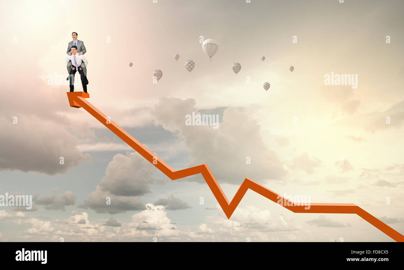Businessman riding on back of his colleague Stock Photo - Alamy