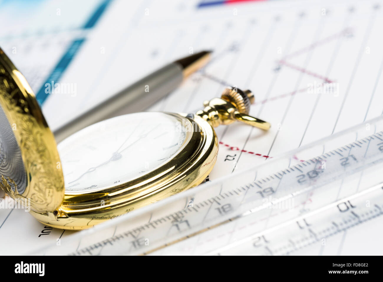 Pocket watch and transparent rulers symbolizing traditional business ...