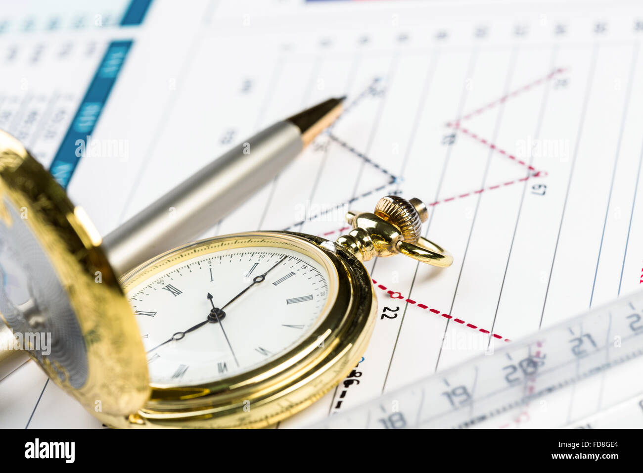 Pocket watch and transparent rulers symbolizing traditional business ...