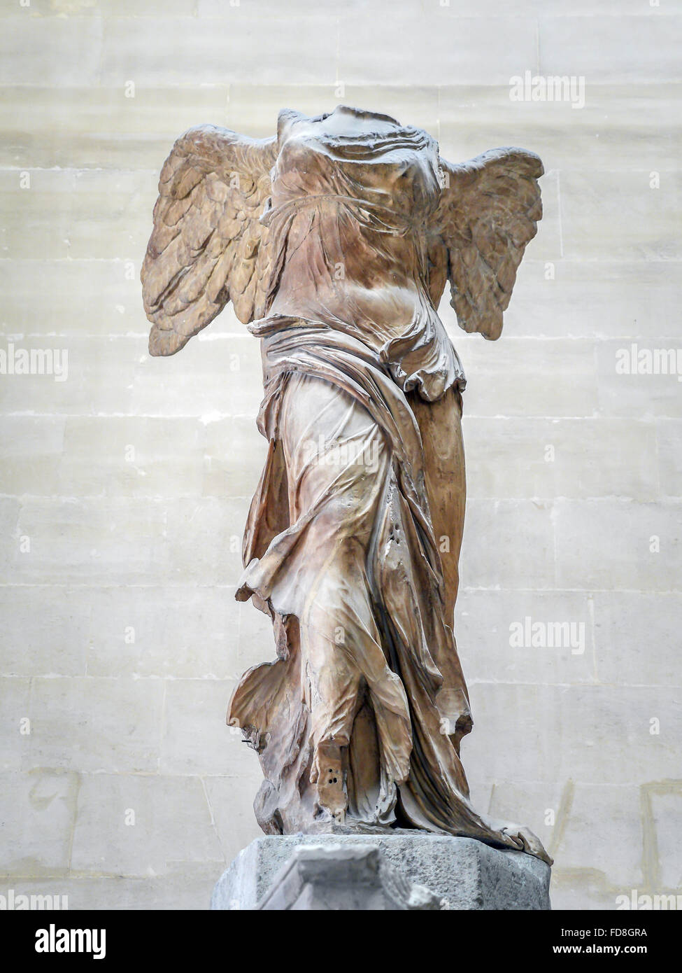 PARIS, FRANCE - AUGUST 28 2013: Winged Victory of Samothrace, also called Nike of Samothrace, exhibited in Louvre Museum Stock Photo