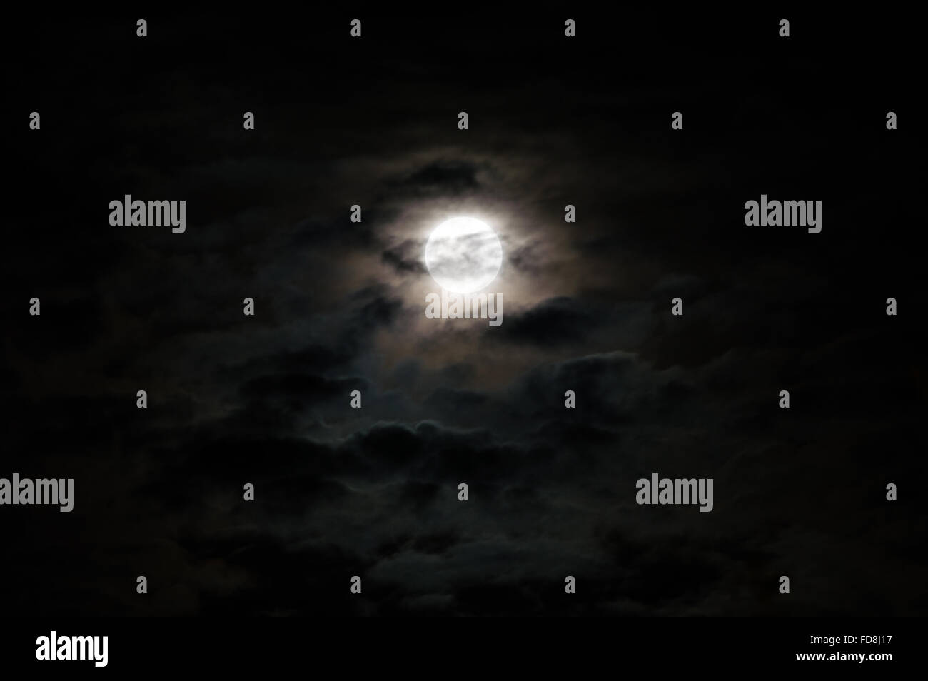 Full moon on a cloudy night Stock Photo Alamy