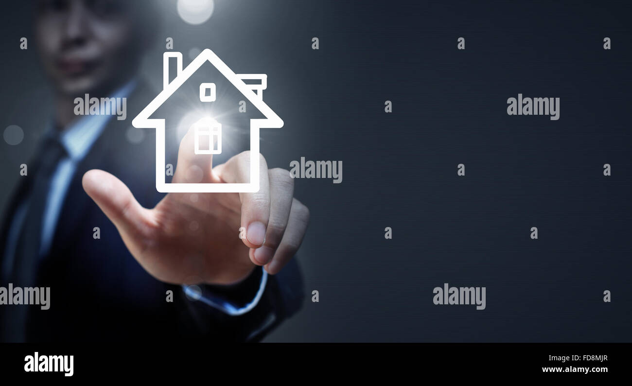 Close up of businessman hand holding house model Stock Photo - Alamy