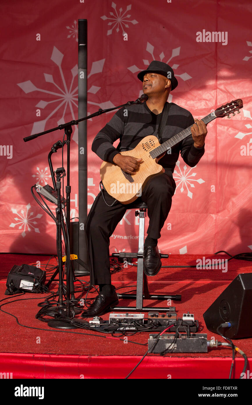 Singer, guitar player performing on stage - USA Stock Photo