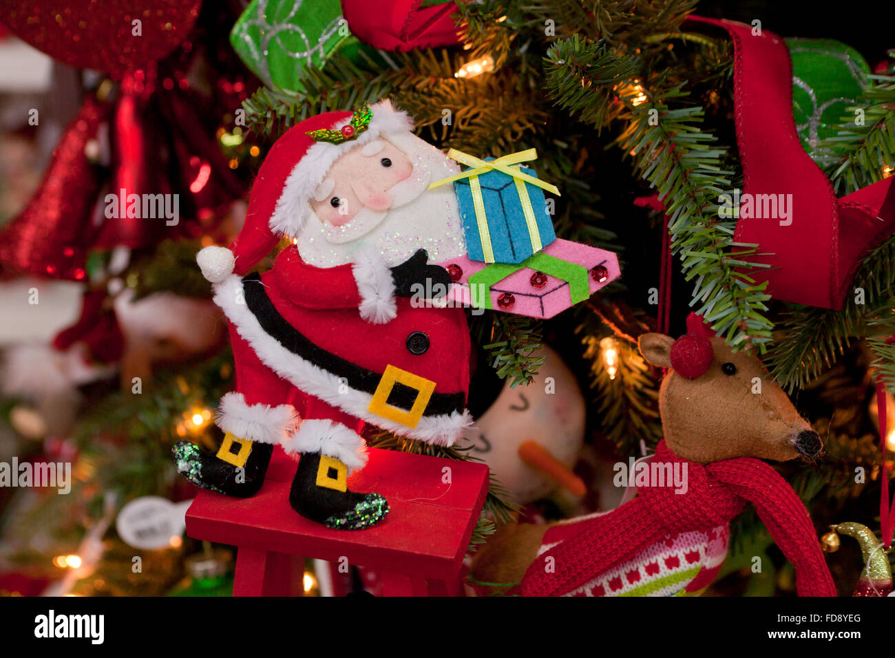 Santa Claus holding presents Christmas tree ornament Stock Photo