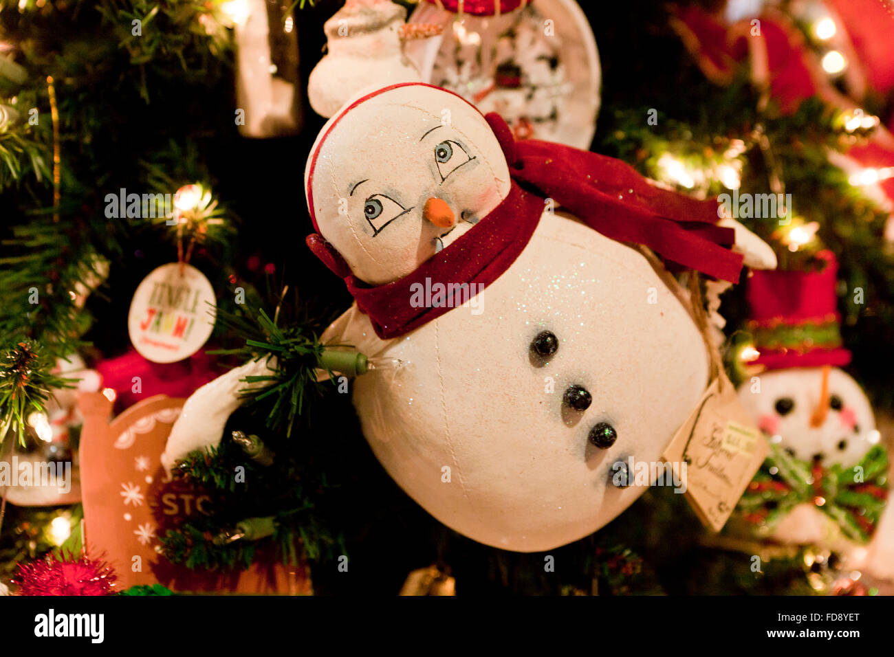 Snowman Christmas ornament on tree Stock Photo